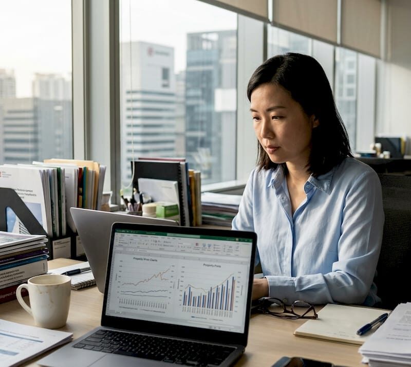 Analyst reviewing Singapore real estate data