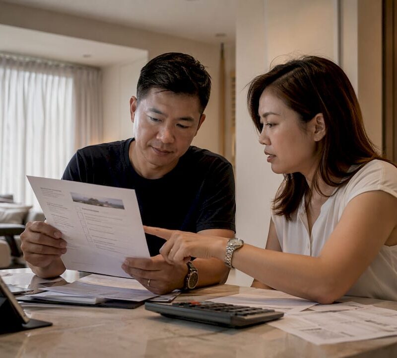 Couple reviewing real estate due diligence checklist