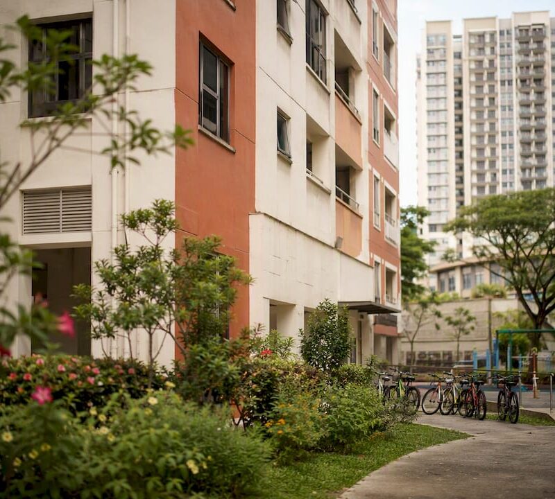 Condo blurred with HDB block entrance