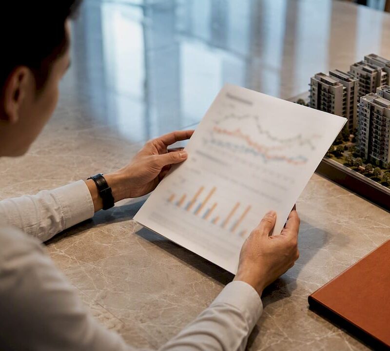 Analyst reviewing Singapore property index data