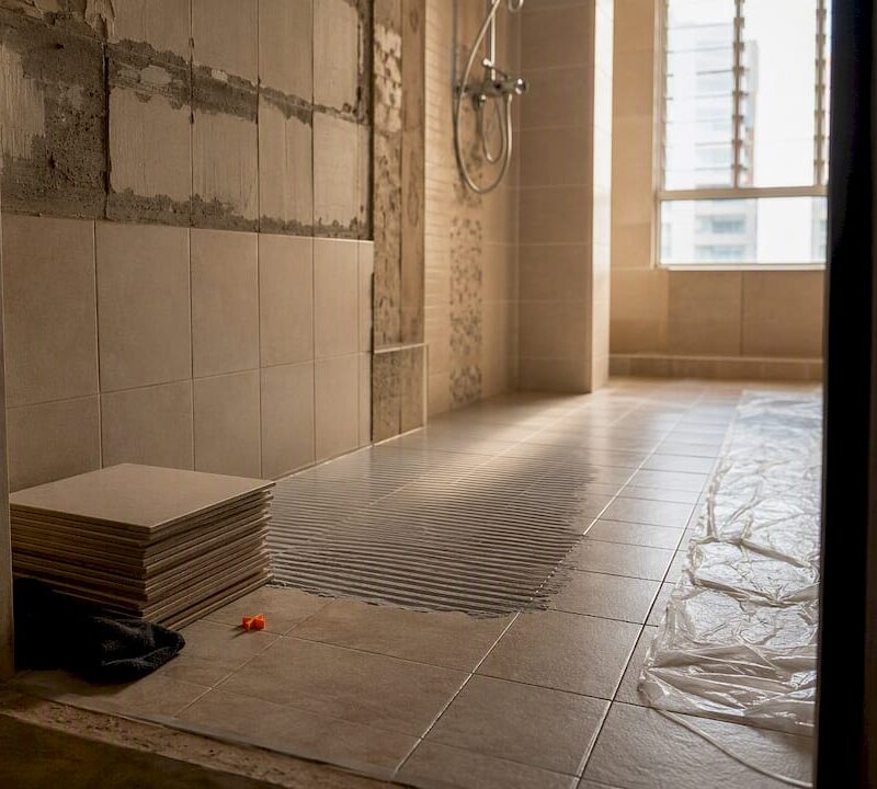 HDB bathroom undergoing tile renovation
