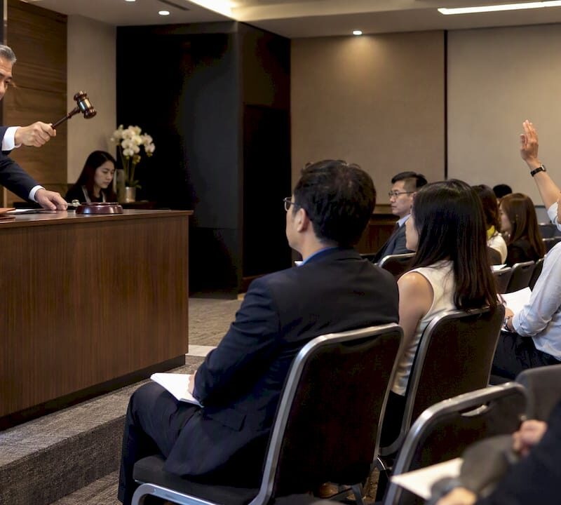 Auctioneer conducting Singapore property auction